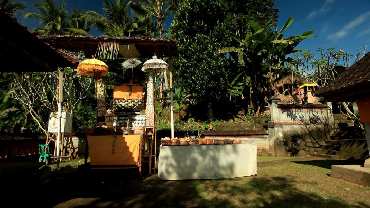 A shot of the first temple, showing a shrine and a table. On the right is a staircase.