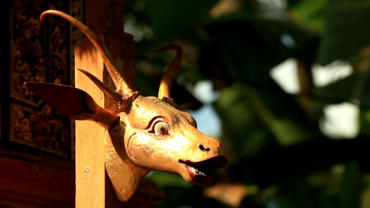 A sculpture of a deer's head in front of a shrine in the second temple.